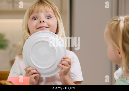 5 year old playing around during breakfast, B.C. Stock Photo