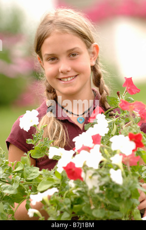 Young girl holding flowers, Regina, Saskatchewan Stock Photo