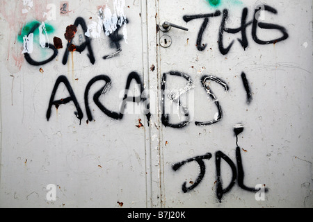 Racist settler graffiti on the gate of a Palestinian house in the Israeli controlled old city area of Hebron. Stock Photo