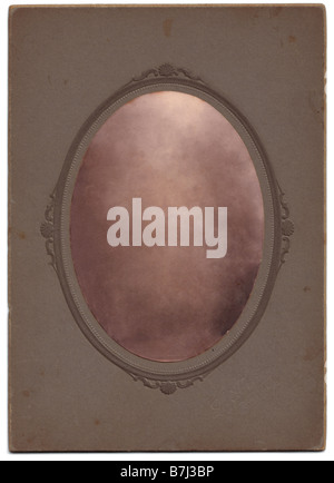 An oval vintage photograph  Clipping paths included. The portrait has been removed,  to allow the easy insertion of any picture. Stock Photo