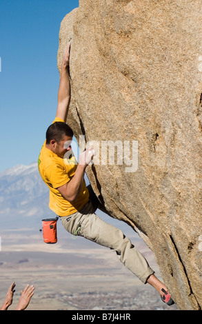 Man (25-30) rock climbing, Bishop, California, USA Stock Photo