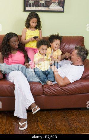 AA mom, Caucasian dad, Mulatto Children, Boy 1.5 years, girl 3 years, girl 6 years. Stock Photo