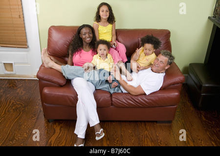 AA mom, Caucasian dad, Mulatto Children, Boy 1.5 years, girl 3 years, girl 6 years. Stock Photo