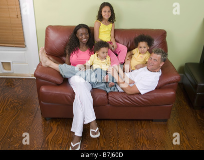 AA mom, Caucasian dad, Mulatto Children, Boy 1.5 years, girl 3 years, girl 6 years. Stock Photo