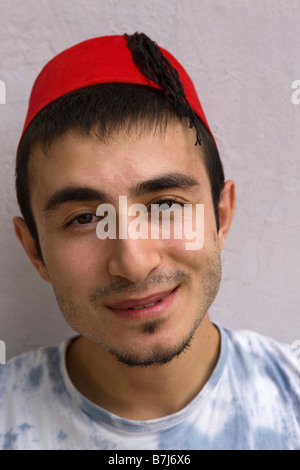 Young Turkish Man wearing Fez Stock Photo