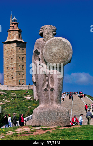 Statue of Breogán in the foreground and the roman Tower of Hercules  in A Coruna, Galicia, Spain Stock Photo