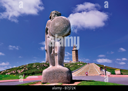 Statue of Breogán in the foreground and the roman Tower of Hercules  in A Coruna, Galicia, Spain Stock Photo