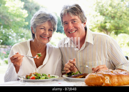 Couple Eating An Al Fresco Meal Stock Photo