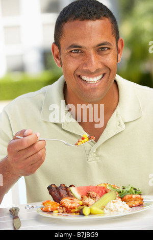 Mid Adult Man Dining Al Fresco Stock Photo