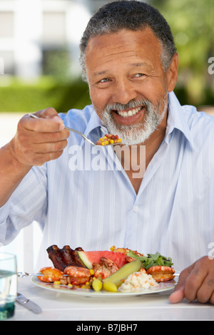 Middle Aged Man Dining Al Fresco Stock Photo
