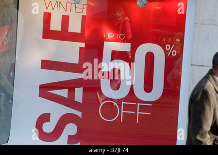 half price sale sign in shop window Stock Photo