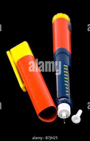 Vertical macro close up of a Diabetic subcutaneous injection or pen containing an ampule of insulin medication on black. Stock Photo