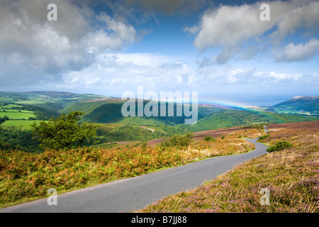 An Exmoor rainbow looking north from Dunkery Hill, Somerset UK - Cloutsham is on the left and Bossington is to the right Stock Photo