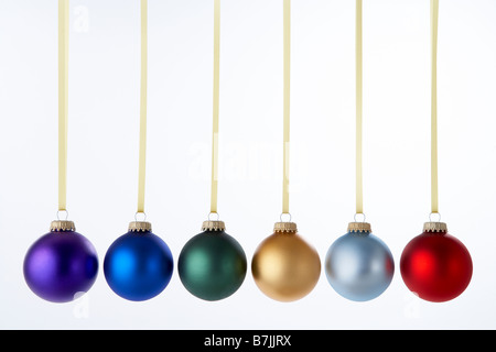 Line Of Christmas Baubles Against White Background Stock Photo