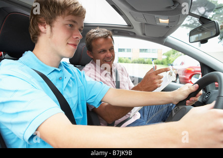 Teenage Boy Taking A Driving Lesson Stock Photo