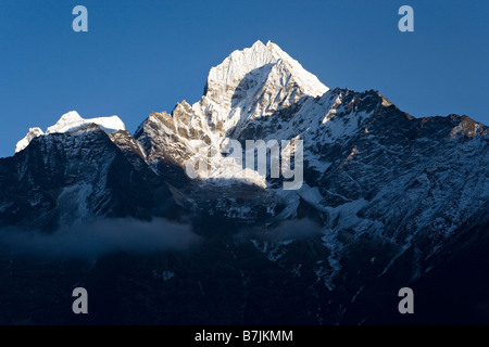 Thamserku is a mountain in the Himalaya of eastern Nepal Stock Photo