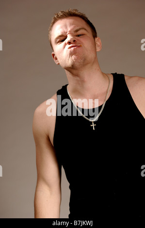 Portrait of young man (21 years of age) snarling; Canada, Saskatchewan, Regina Stock Photo