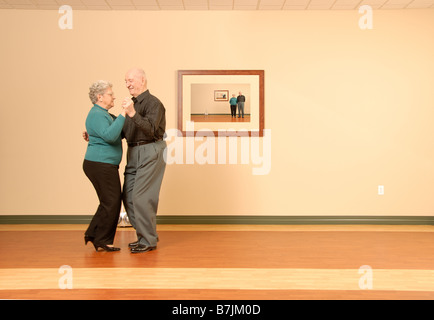 Senior Couple Dancing; Canada, Saskatchewan, Regina Stock Photo
