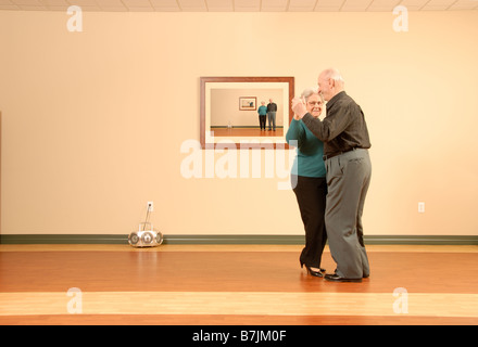 Senior Couple Dancing; Canada, Saskatchewan, Regina Stock Photo