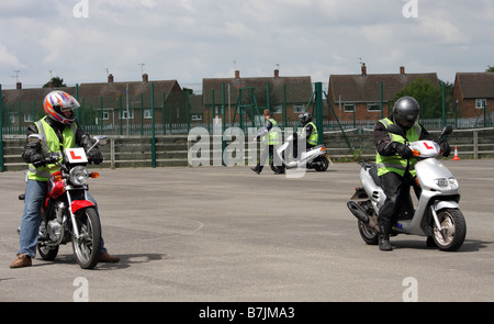 Three young men taking part in their cbt test Stock Photo