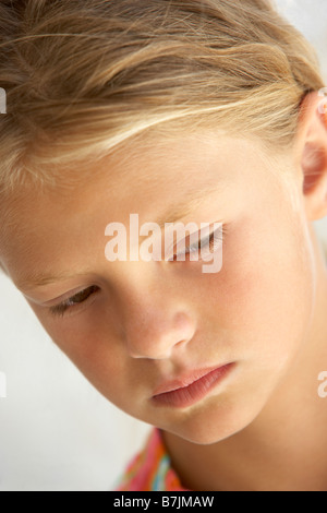 Portrait Of Girl Looking Unhappy Stock Photo