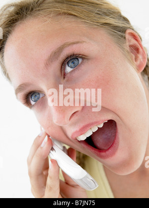 Portrait Of Teenage Girl Smiling And Talking On Cellphone Stock Photo