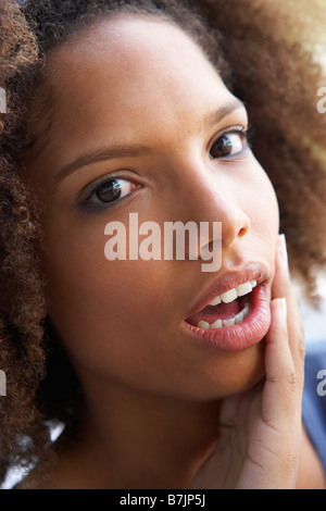 Portrait Of Teenage Girl Looking Shocked Stock Photo