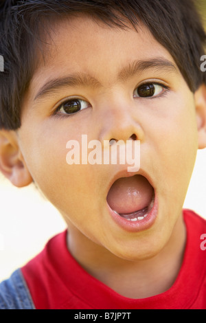 Portrait Of Boy Looking Surprised Stock Photo