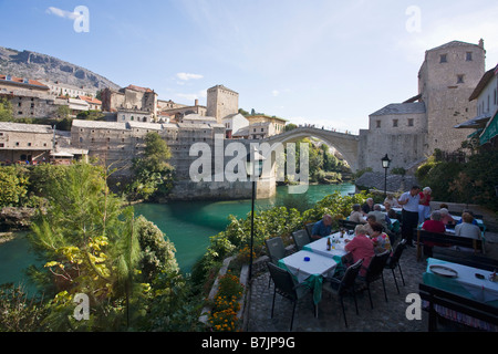 Historic Old Town of Mostar and restored 16th century bridge across the Neretva River in Bosnia Herzegovina Europe Stock Photo