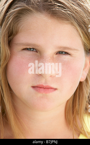 Portrait Of Pre-Teen Girl Sulking Stock Photo