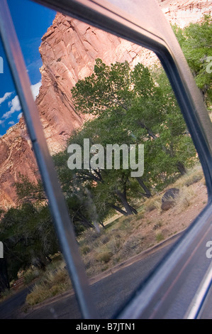 Cliffs reflect in truck camper window parked at the Visitor Center, Capitol Reef National Park, Utah. Stock Photo