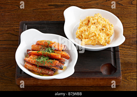 vegetable side dishes roasted carrots mashed swede celeriac Stock Photo