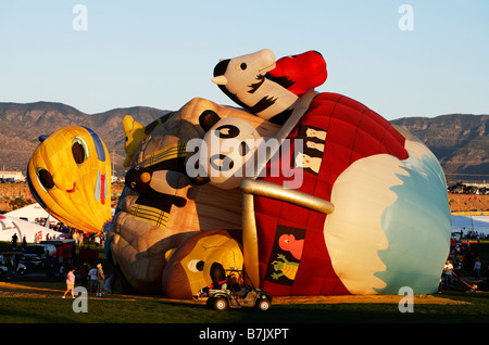 Giant, whimsical hot air balloons are inflated during the 2008 Albuquerque International Balloon Fiesta at Balloon Fiesta Park. Stock Photo