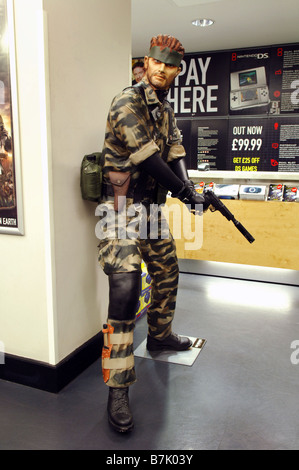 A life size character model in-store statue display of 'Snake' a character from the computer game Metal Gear Solid. Stock Photo