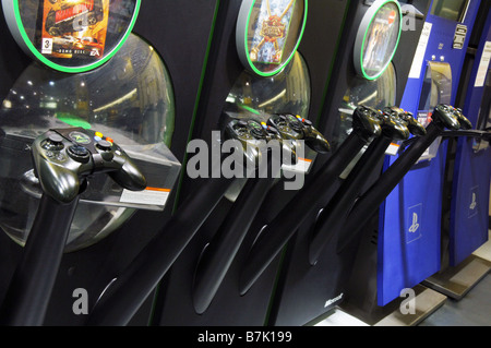 A row of joy pads joy sticks in HMV for potential customers to try our new computer games on. Stock Photo