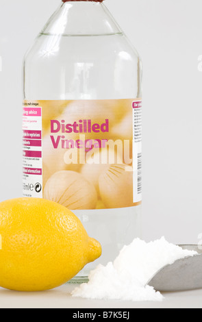White Vinegar with baking soda and a single lemon Stock Photo