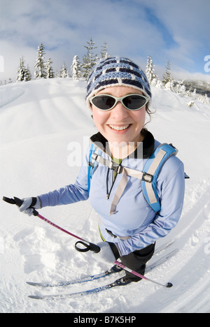 A woman cross-country skiing, Strathcona Provincial Park near Courtenay, BC, Canada Stock Photo