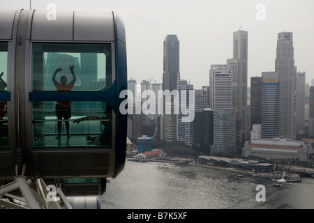 Passengers are seen in a capsule on the Singapore Flyer in Singapore Stock Photo