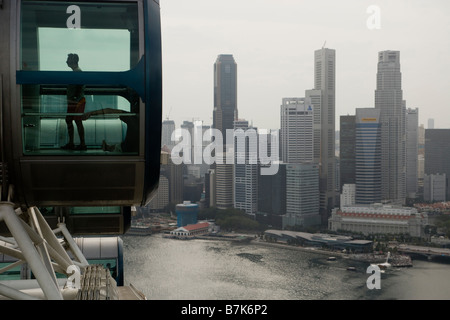 Passengers are seen in a capsule on the Singapore Flyer in Singapore Stock Photo