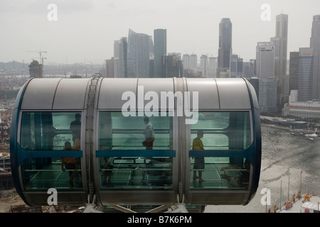 Passengers are seen in a capsule on the Singapore Flyer in Singapore Stock Photo