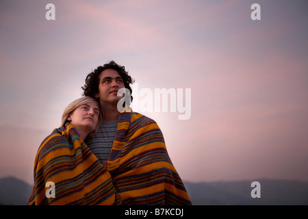 couple sharing a blanket Stock Photo