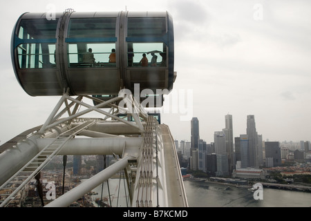 Passengers are seen in a capsule on the Singapore Flyer in Singapore Stock Photo