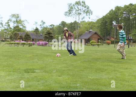 Young Men Playing Soccer Stock Photo