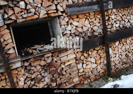 wood supply old fashioned Austrian shed in winter Stock Photo