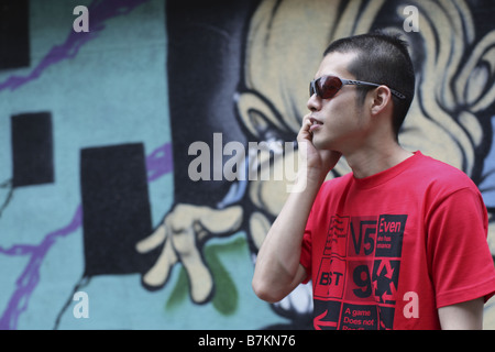 Man in Sunglasses Talking on Cell-phone Stock Photo