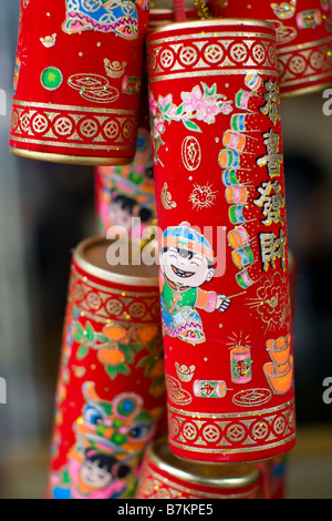 Chinese fire cracker good luck charms hanging during Chinese New Year in Hong Kong Stock Photo