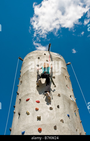 Aspen Mountain offers many kids' activities in the summer for families on vacation, including a rock textured climbing wall. Stock Photo