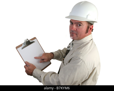 a construction inspector pointing with concern to his report on this clipboard isolated Stock Photo