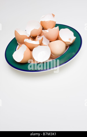 Broken eggshells in a bowl Stock Photo