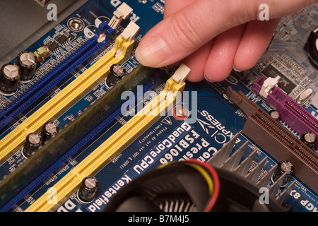 Replacing memory modules on Motherboard Stock Photo